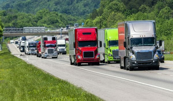 Cluster of semi trucks on an interstate highway